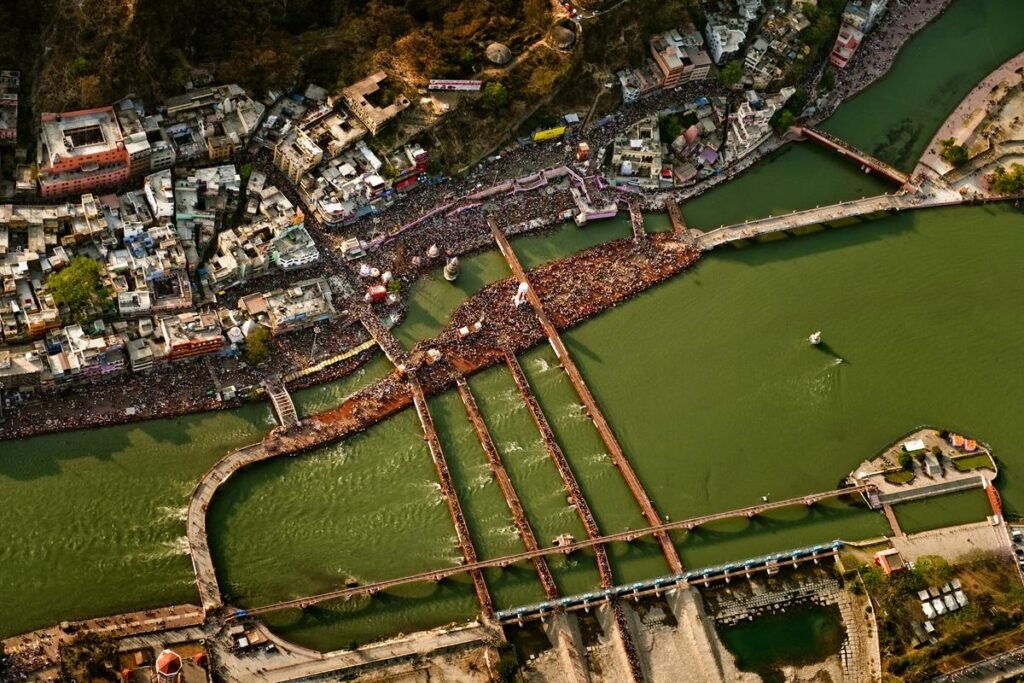 An aerial view of Har Ki Pauri, Haridwar, with the Ganga channels, footbridges and crowded ghats.