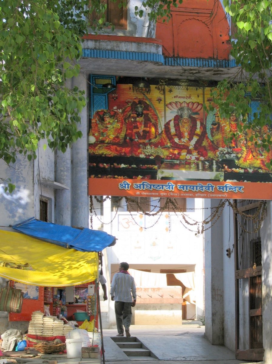 The entrance of the Maya Devi Temple in Haridwar, with a painted panel of the goddess above the doorway