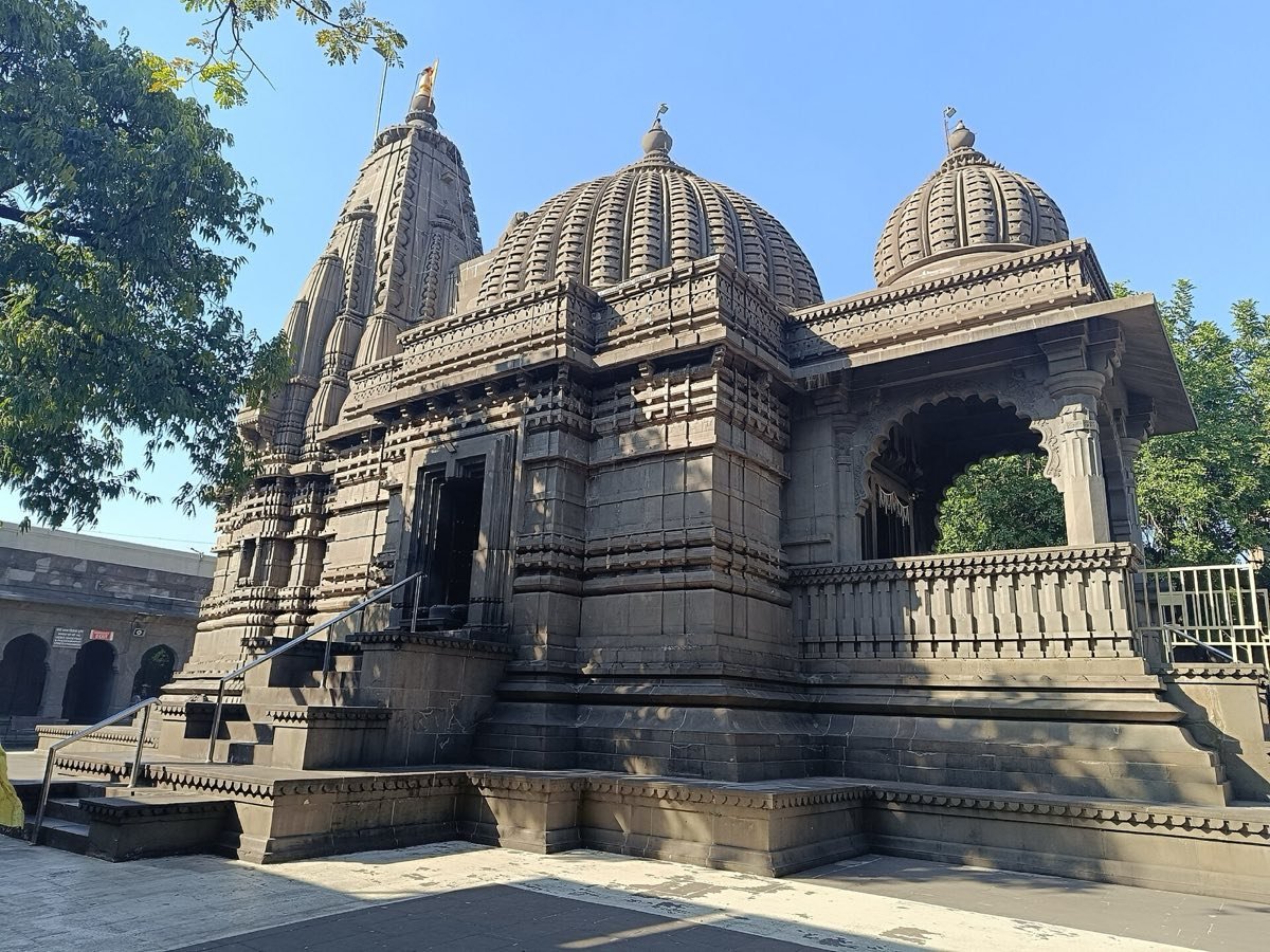 The black stone Kalaram Temple in Panchavati, Nashik, under a clear blue sky
