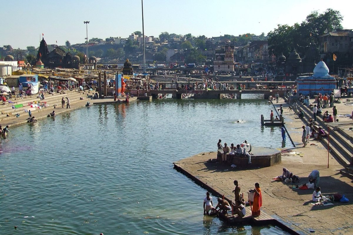 The Godavari ghats at Panchavati, Nashik, with riverside temples and pilgrims at the water
