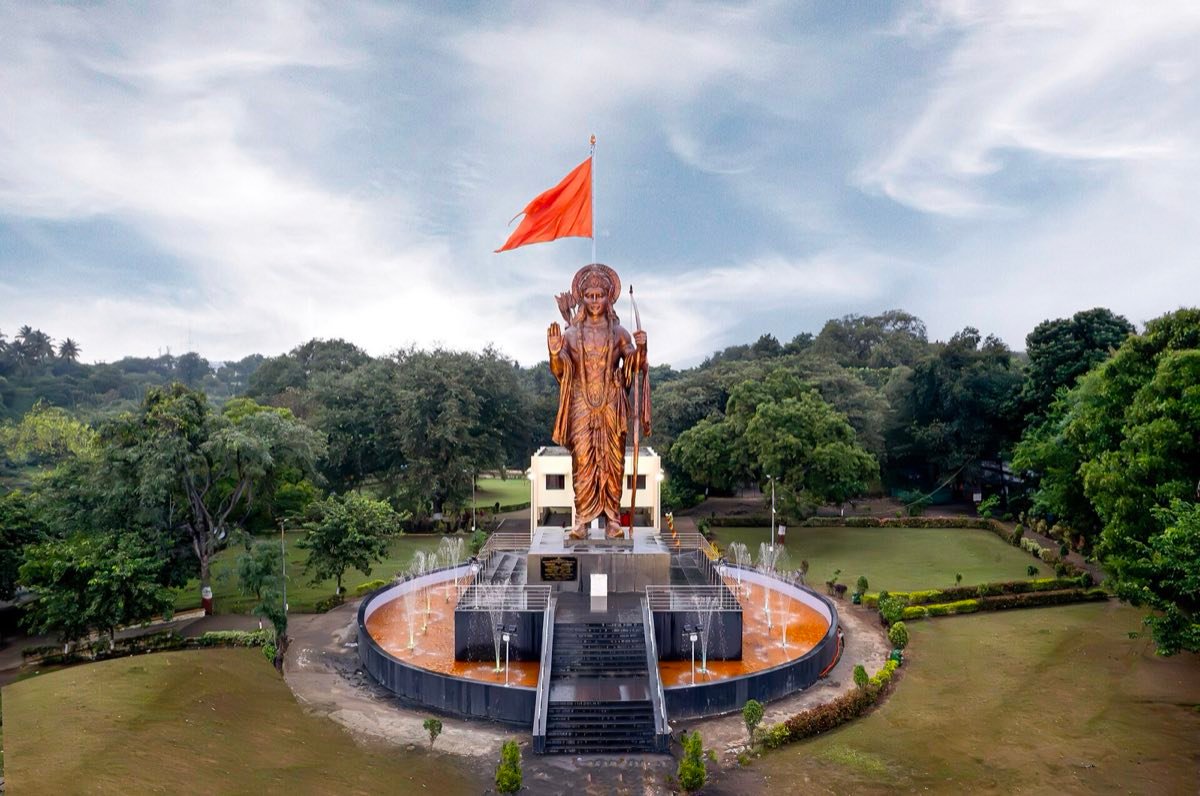 An aerial view of the tall statue of Shri Ram in a garden at Tapovan, Nashik