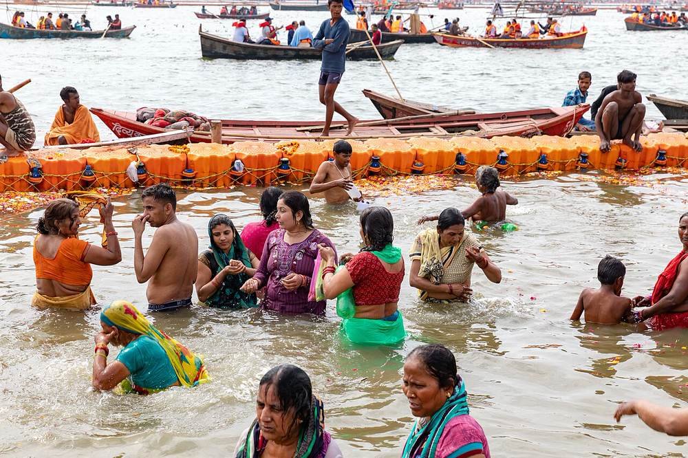Pilgrims taking a dip at the Sangam, Prayagraj