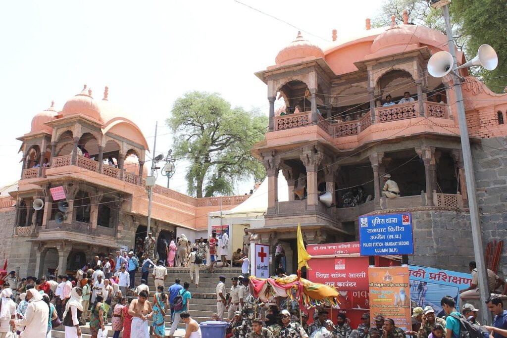 Pilgrims climbing the steps beside the old carved buildings above Ram Ghat during the Simhastha of 2016.